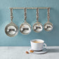 pewter dragonfly measuring cups on wall strip