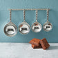 pewter heart measuring cups on wall strip