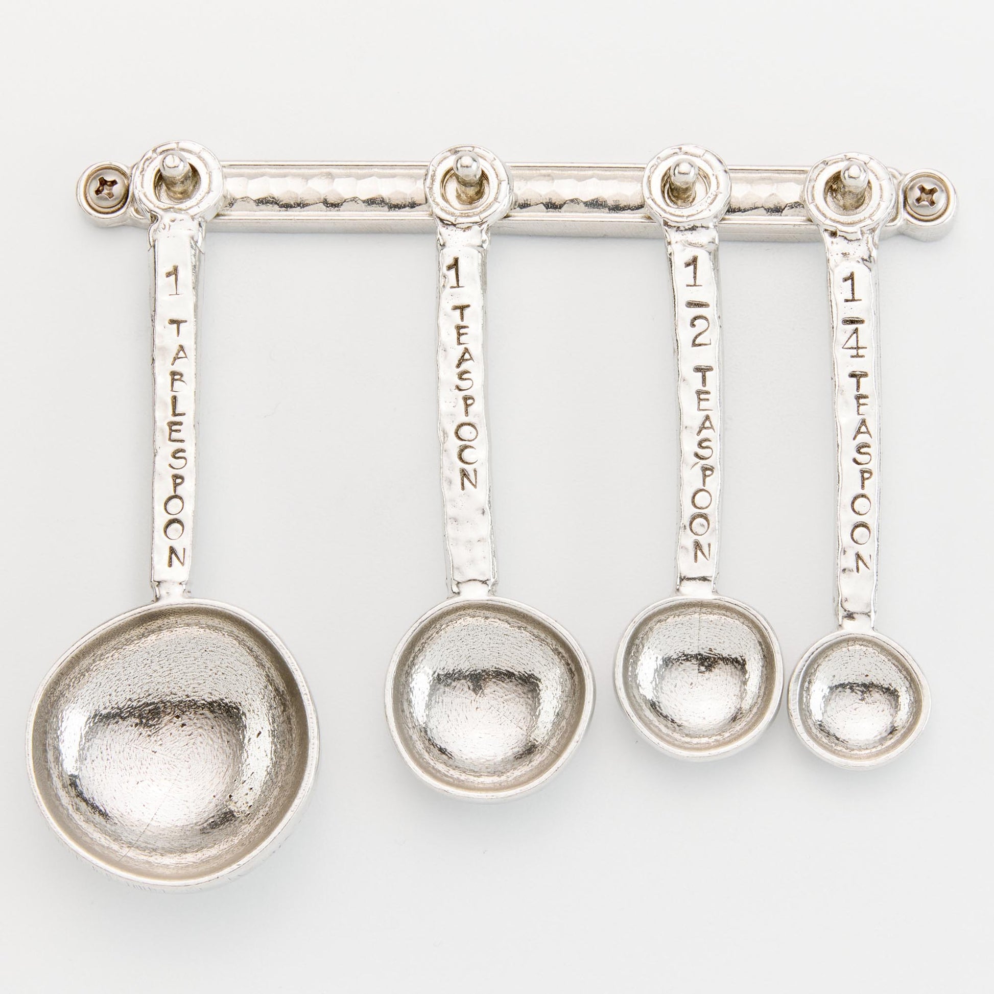 pewter Homestead Measuring Spoons on wall strip